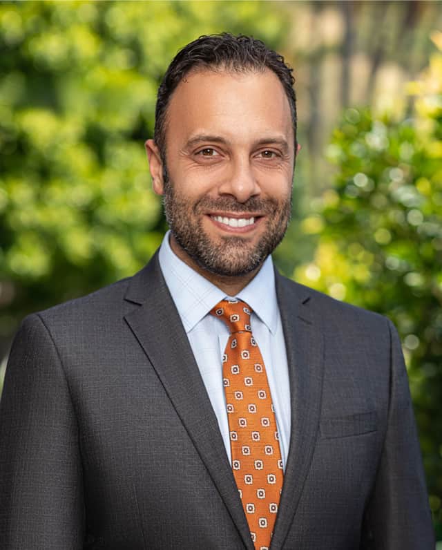 image of Kaveh Keshemiri with a green background
